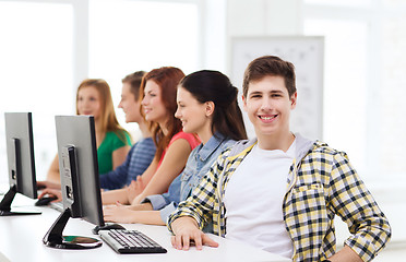 Image showing male student with classmates in computer class