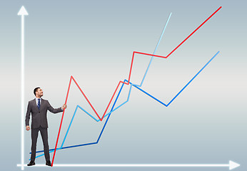 Image showing smiling man holding graph line