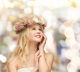 Image showing young woman wearing wreath of flowers