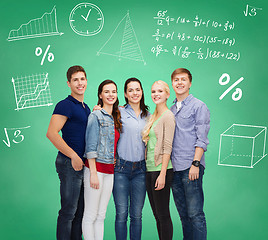 Image showing group of smiling students over green board