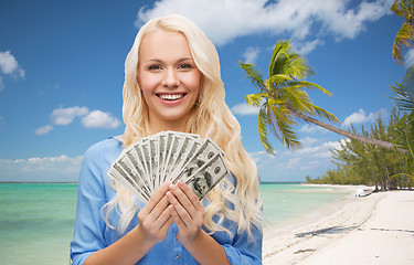 Image showing smiling young woman with us dollar money