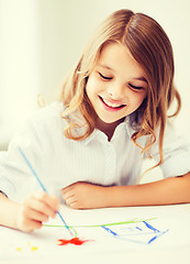 Image showing little girl painting at school