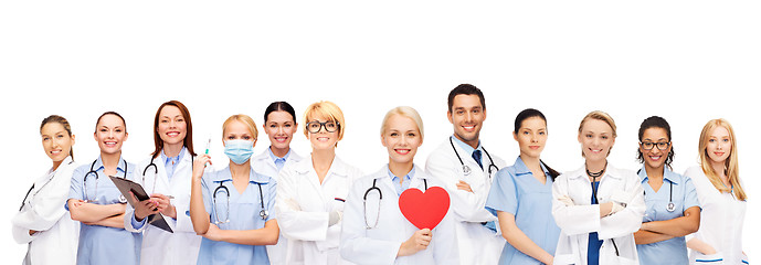 Image showing smiling doctors and nurses with red heart