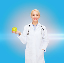 Image showing smiling female doctor with green apple