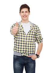 Image showing smiling student boy showing thumbs up