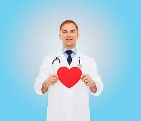 Image showing smiling male doctor with red heart and stethoscope