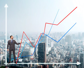 Image showing smiling man holding graph line