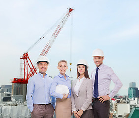 Image showing group of smiling businessmen in white helmets