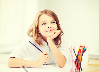 Image showing girl drawing with pencils at school