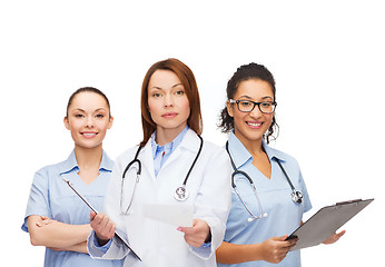 Image showing calm female doctor with clipboard