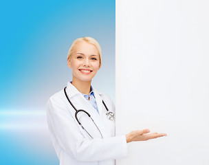 Image showing smiling female doctor with stethoscope