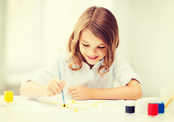 Image showing little girl painting at school