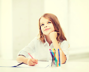 Image showing little student girl drawing at school