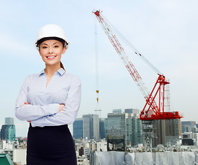 Image showing businesswoman in white helmet