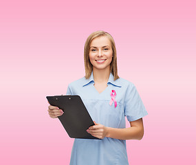 Image showing female nurse with stethoscope and clipboard