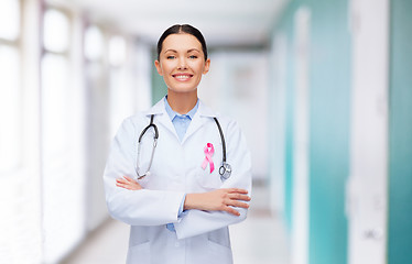 Image showing doctor with stethoscope, cancer awareness ribbon