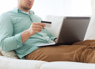 Image showing close up of man with laptop and credit card