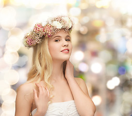 Image showing young woman wearing wreath of flowers