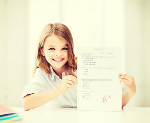 Image showing girl with test and A grade at school