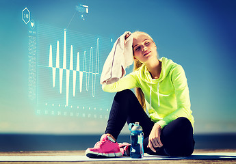 Image showing woman resting after doing sports outdoors