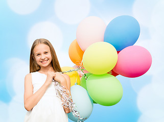 Image showing happy girl with colorful balloons