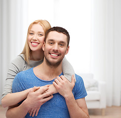 Image showing smiling couple hugging