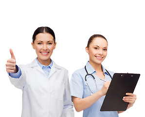 Image showing smiling female doctor and nurse