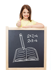 Image showing smiling girl with blackboard showing thumbs up