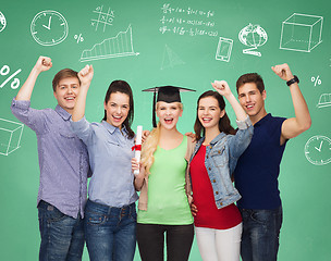 Image showing group of smiling students over green board