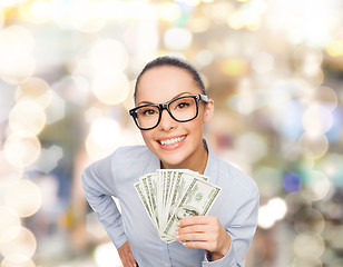 Image showing smiling businesswoman with dollar cash money