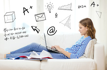 Image showing busy teenage girl with laptop computer at home