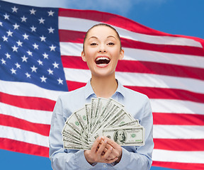 Image showing laughing businesswoman with dollar cash money