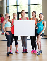 Image showing - group of women witn white blank billboard