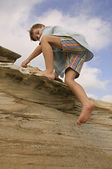 Image showing Clambering over rocks