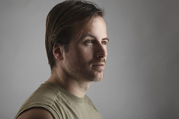 Image showing Portrait of an attractive man with green shirt