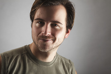 Image showing Portrait of an attractive man with green shirt