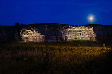 Image showing Moonlight over illuminated cliffs