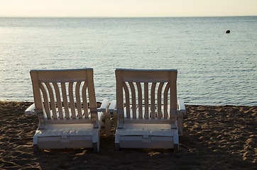 Image showing Two armchairs at beach