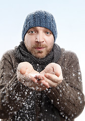 Image showing Portrait of an attractive man in the snow