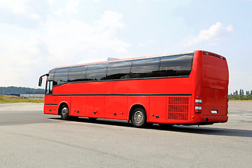 Image showing Red Coach Bus Departs for Journey