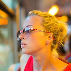 Image showing Woman looking out tram's window.