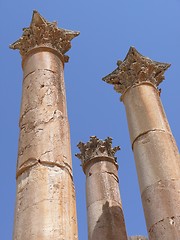 Image showing Three ancient columns against clear blue sky, Jerash, Jordan