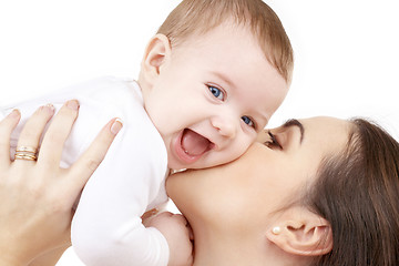 Image showing happy mother kissing baby