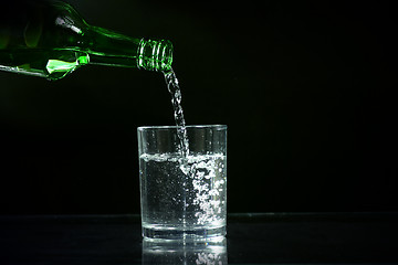 Image showing wine bottle and glass of ice