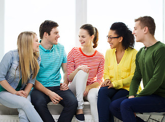 Image showing five smiling teenagers having fun at home