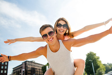 Image showing smiling couple having fun in city