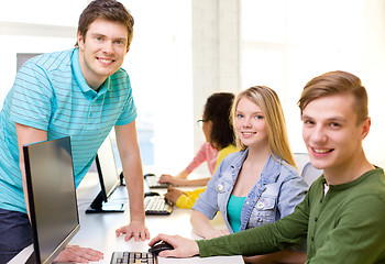 Image showing group of smiling students in computer class