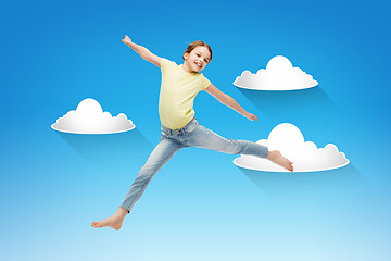 Image showing smiling little girl jumping