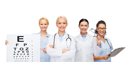 Image showing smiling female eye doctors and nurses