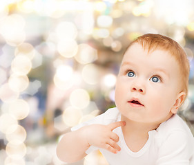 Image showing curious baby looking up